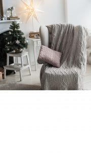 Cozy gray blanket on chair
