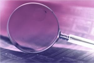 magnifying glass on purple background