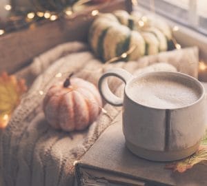 Warm cup of coffee on a cozy autumn morning